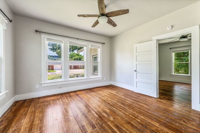 1143 W Jones St, Stephenville, TX 76401 - empty room with a ceiling fan, hardwood / wood-style flooring, and a smoke detector