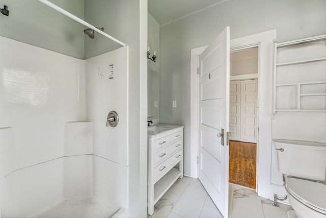 1143 W Jones St, Stephenville, TX 76401 - bathroom with a stall shower, marble finish flooring, and vanity