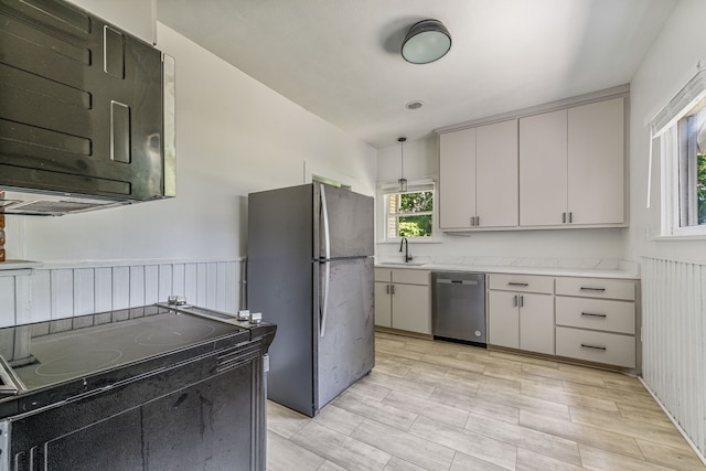 1143 W Jones St, Stephenville, TX 76401 - kitchen with appliances with stainless steel finishes and wainscoting