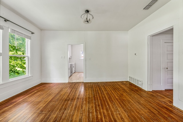 1143 W Jones St, Stephenville, TX 76401 - spare room with hardwood / wood-style flooring and baseboards