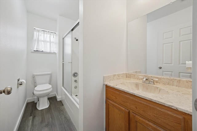416 W 3rd St, Justin, TX 76247 - bathroom featuring vanity, wood finished floors, and enclosed tub / shower combo