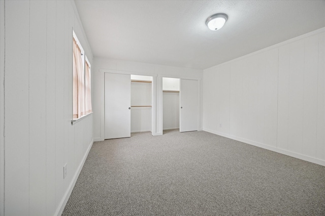 416 W 3rd St, Justin, TX 76247 - unfurnished bedroom with carpet floors and multiple closets