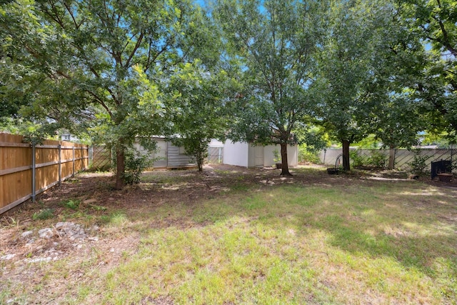 416 W 3rd St, Justin, TX 76247 - fenced backyard featuring a storage unit