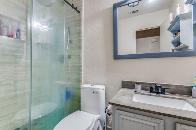 1008 Brook Cyn, Arlington, TX 76018 - bathroom with a textured wall, vanity, and a stall shower