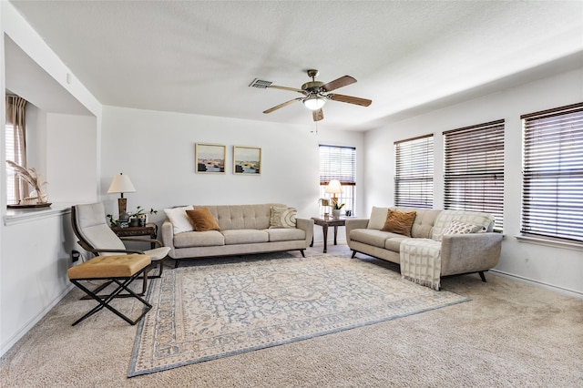 9507 Tallow Berry Dr, Dallas, TX 75249 - carpeted living area with ceiling fan and baseboards