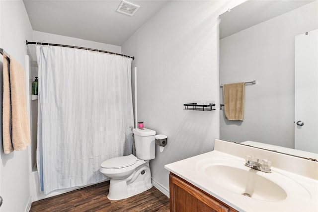 9507 Tallow Berry Dr, Dallas, TX 75249 - bathroom with vanity, wood finished floors, and shower / tub combo with curtain