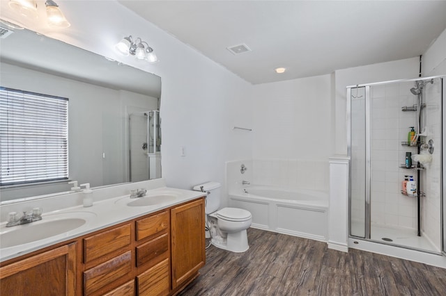 9507 Tallow Berry Dr, Dallas, TX 75249 - full bathroom with a shower stall, a garden tub, wood finished floors, and double vanity