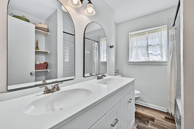 1031 Patricia Dr, Sherman, TX 75090 - full bath with double vanity, wood finished floors, and shower / bath combination with curtain