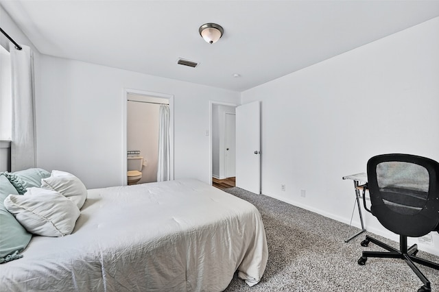 1031 Patricia Dr, Sherman, TX 75090 - carpeted bedroom with ensuite bath and baseboards