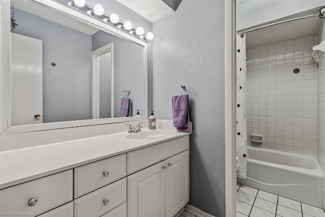 910 Meadowside Cir, Garland, TX 75043 - bathroom featuring vanity, shower / bath combo, and a textured wall