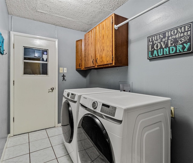 910 Meadowside Cir, Garland, TX 75043 - washroom featuring cabinet space, washer and clothes dryer, and a textured ceiling