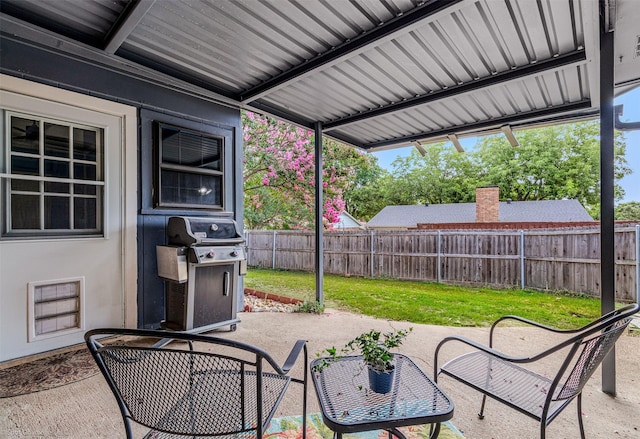 910 Meadowside Cir, Garland, TX 75043 - fenced backyard featuring a patio area and grilling area