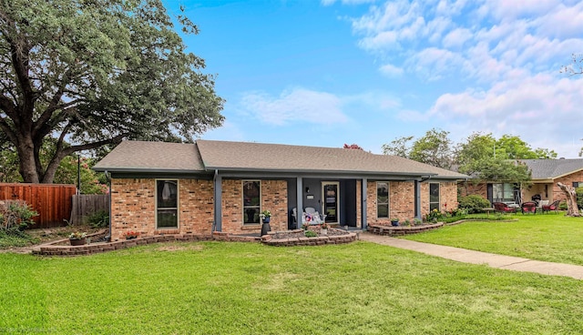 910 Meadowside Cir, Garland, TX 75043 - ranch-style house with brick siding, a porch, and roof with shingles