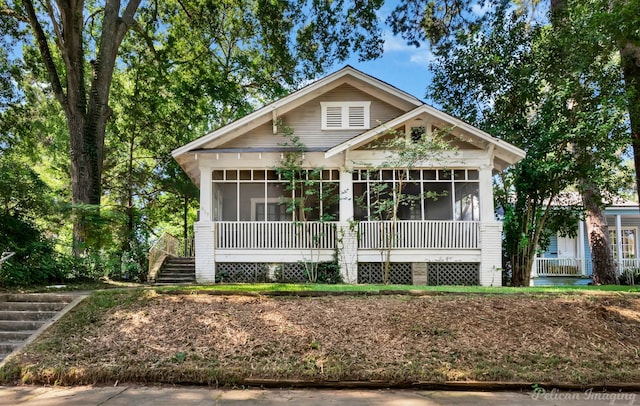 619 College St, Shreveport, LA 71104 - view of front of home with a sunroom and stairway