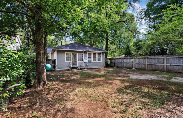 619 College St, Shreveport, LA 71104 - back of house with entry steps and a fenced backyard