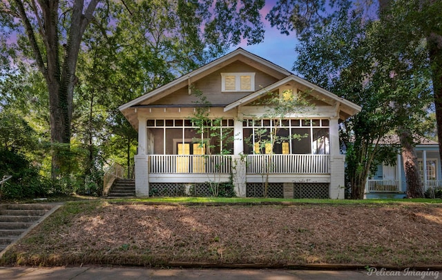 619 College St, Shreveport, LA 71104 - view of front of property featuring a sunroom and stairs