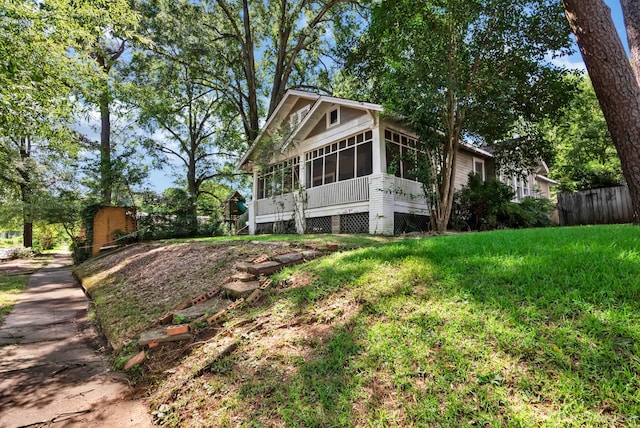 619 College St, Shreveport, LA 71104 - view of property exterior featuring a sunroom