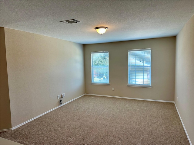 2717 Big Spring Dr, Fort Worth, TX 76120 - empty room featuring carpet and a textured ceiling