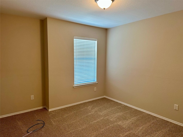2717 Big Spring Dr, Fort Worth, TX 76120 - unfurnished room featuring dark colored carpet and plenty of natural light