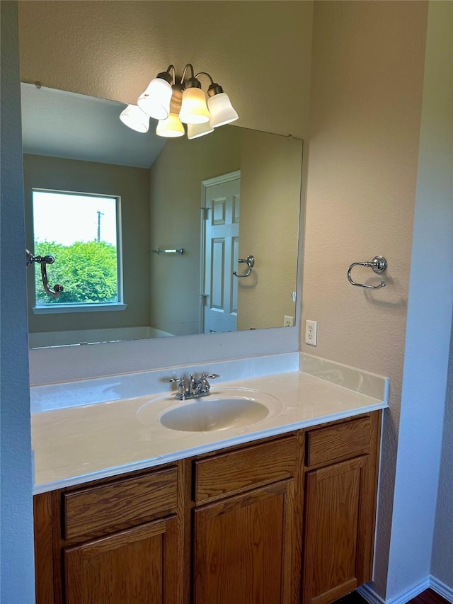 2717 Big Spring Dr, Fort Worth, TX 76120 - bathroom with vanity and a textured wall