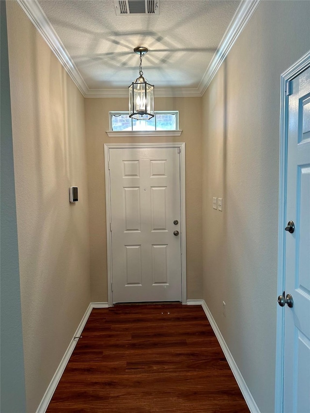 2717 Big Spring Dr, Fort Worth, TX 76120 - doorway to outside featuring dark wood finished floors, a chandelier, a textured ceiling, and crown molding