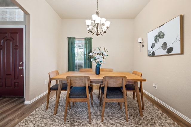 5520 Plata Ln, Benbrook, TX 76126 - dining area with a chandelier, dark wood-type flooring, and plenty of natural light