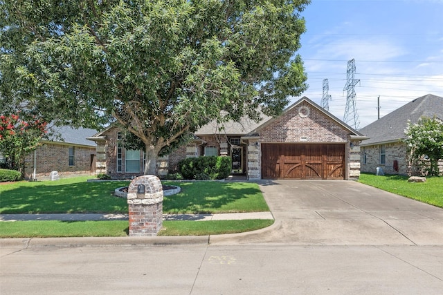 5520 Plata Ln, Benbrook, TX 76126 - view of front of house with brick siding, a garage, a front lawn, and driveway