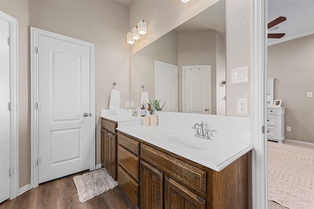 5520 Plata Ln, Benbrook, TX 76126 - full bath with double vanity, wood finished floors, ornamental molding, and ceiling fan