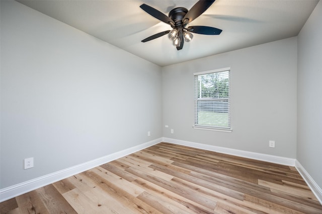 1402 N Mason St, Bowie, TX 76230 - unfurnished room featuring wood finished floors and ceiling fan