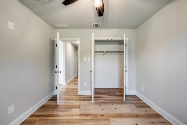 1402 N Mason St, Bowie, TX 76230 - unfurnished bedroom featuring light wood-style flooring, a closet, and ceiling fan