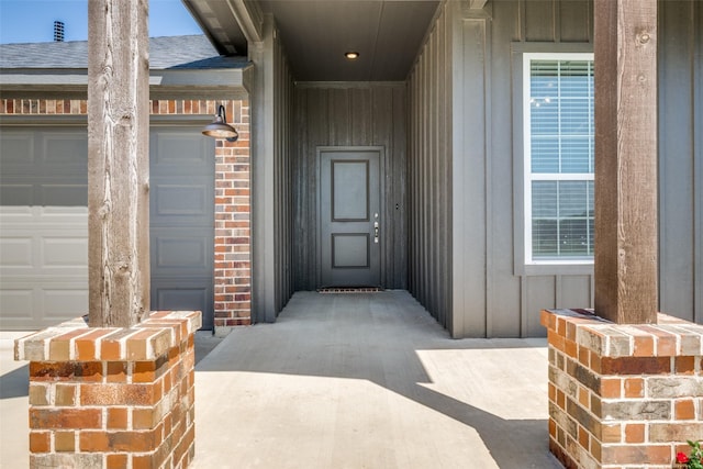 1402 N Mason St, Bowie, TX 76230 - doorway to property featuring board and batten siding and roof with shingles