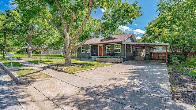 1250 N Isla St, Stephenville, TX 76401 - view of front facade with driveway and an attached carport