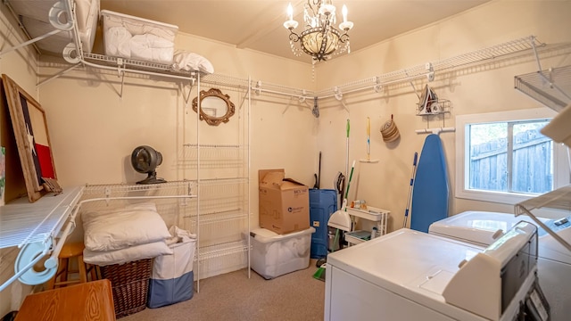 1250 N Isla St, Stephenville, TX 76401 - washroom with washer and clothes dryer, light carpet, and a chandelier