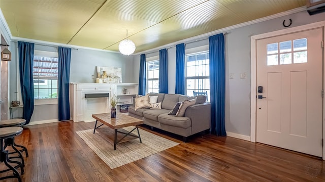 1250 N Isla St, Stephenville, TX 76401 - living area with crown molding, hardwood / wood-style floors, healthy amount of natural light, and a fireplace