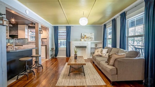 1250 N Isla St, Stephenville, TX 76401 - living area featuring plenty of natural light, ornamental molding, wood finished floors, and a fireplace