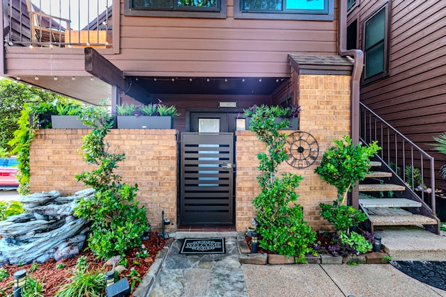 1704 Baird Farm Cir Unit 4104, Arlington, TX 76006 - doorway to property featuring brick siding and a gate