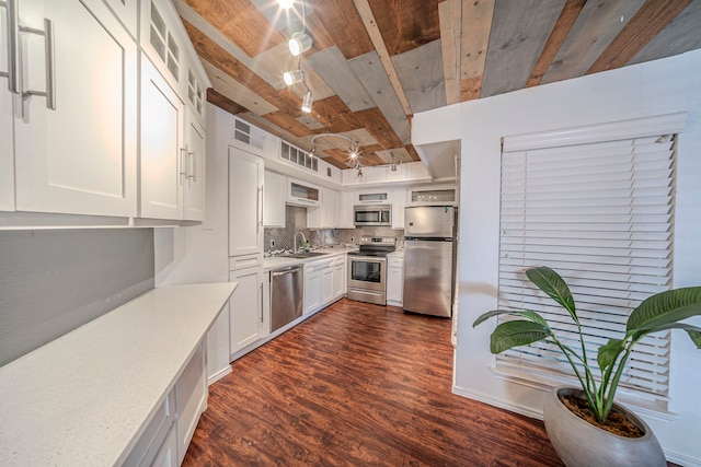 1704 Baird Farm Cir Unit 4104, Arlington, TX 76006 - kitchen with appliances with stainless steel finishes, dark wood-type flooring, light countertops, white cabinetry, and backsplash