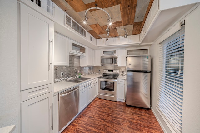 1704 Baird Farm Cir Unit 4104, Arlington, TX 76006 - kitchen with stainless steel appliances, wood ceiling, dark wood-style flooring, decorative backsplash, and white cabinetry