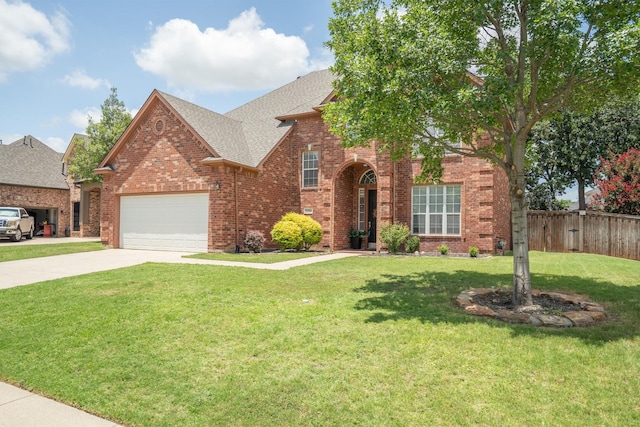 2309 Chambray Dr, Corinth, TX 76210 - traditional-style home with a garage, brick siding, concrete driveway, and roof with shingles