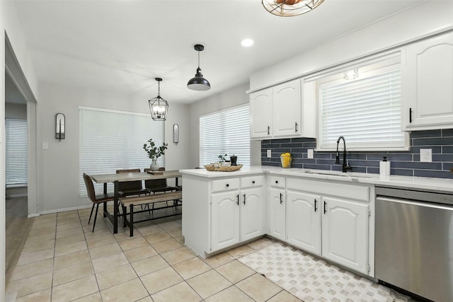 800 Madison St, Cleburne, TX 76033 - kitchen featuring stainless steel dishwasher, light tile patterned floors, backsplash, and recessed lighting
