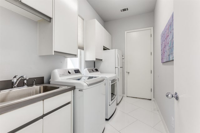 17503 Torrey Pine Dr, Dallas, TX 75287 - laundry area with washer and dryer and cabinet space