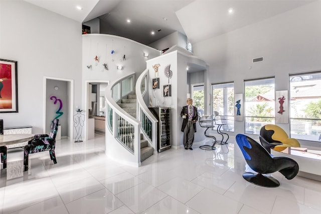17503 Torrey Pine Dr, Dallas, TX 75287 - staircase with a towering ceiling and recessed lighting