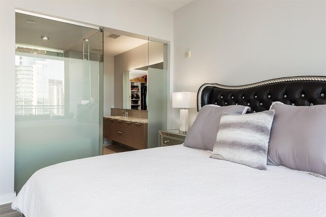 2900 Mckinnon St Unit 1001, Dallas, TX 75201 - bedroom featuring ensuite bath