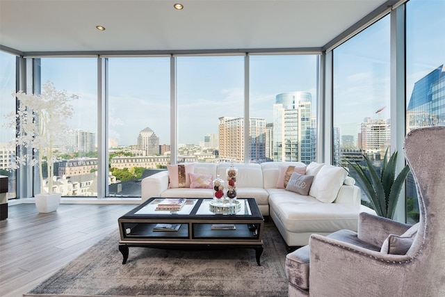 2900 Mckinnon St Unit 1001, Dallas, TX 75201 - living area featuring a skyline view, wood finished floors, expansive windows, and recessed lighting