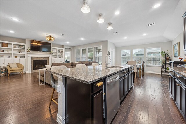 933 Basket Willow Ter, Fort Worth, TX 76052 - kitchen with dishwasher, dark wood finished floors, healthy amount of natural light, light stone countertops, and recessed lighting