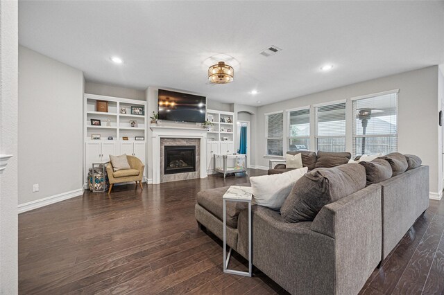 933 Basket Willow Ter, Fort Worth, TX 76052 - living area featuring dark wood-type flooring, a glass covered fireplace, and recessed lighting