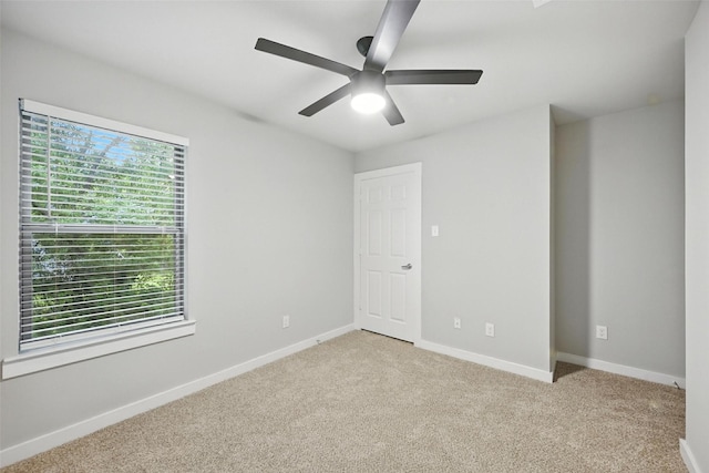 324 W Munson St Unit 326, Denison, TX 75020 - unfurnished bedroom featuring carpet floors and ceiling fan