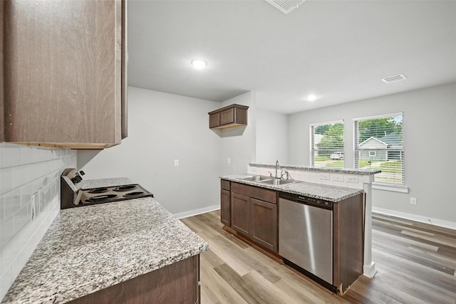 324 W Munson St Unit 326, Denison, TX 75020 - kitchen with stainless steel dishwasher, electric stove, light wood-style flooring, tasteful backsplash, and recessed lighting