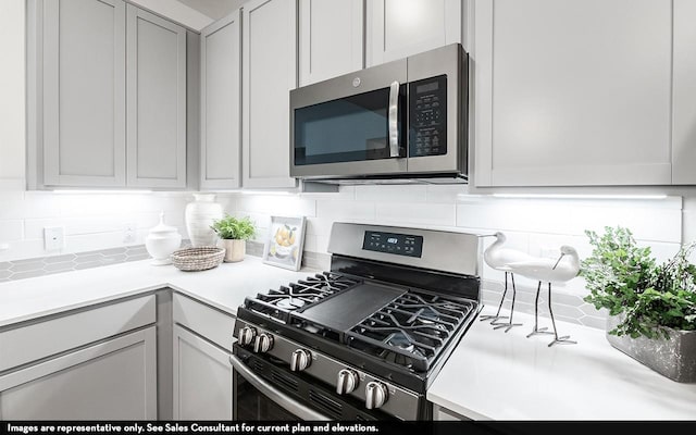 2013 Placerville St, Forney, TX 75126 - kitchen featuring stainless steel appliances, tasteful backsplash, and light countertops