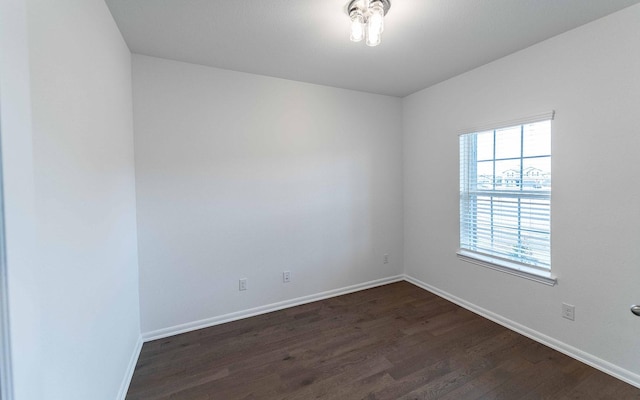 2219 Bridgeport St, Forney, TX 75126 - spare room featuring dark wood-style floors and baseboards